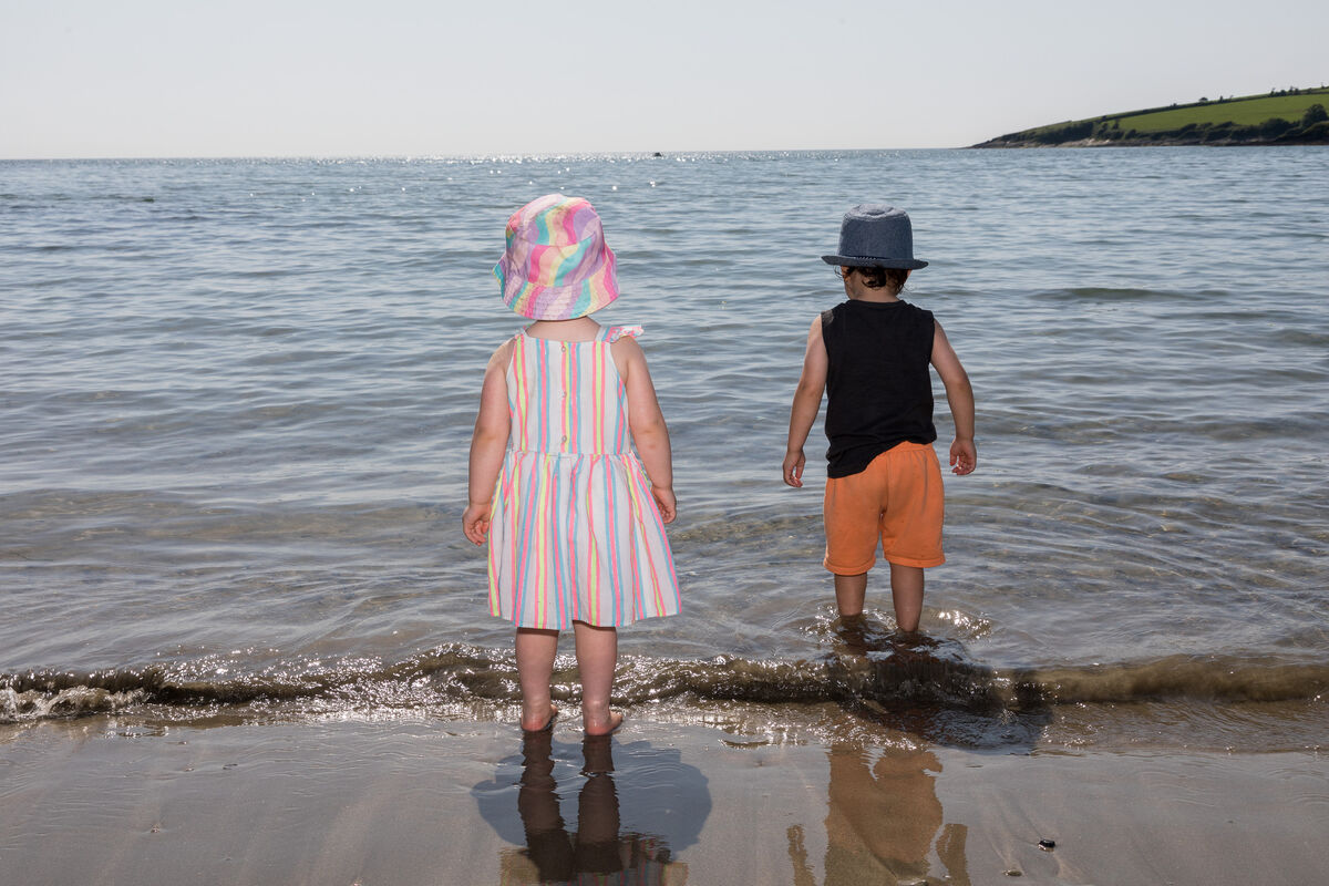 Kids paddle along the shoreline in Fountainstown, Co. Cork, as warm weather draws crowds to the popular beach. Picture: David Creedon Kids paddle along the shoreline in Fountainstown, Co. Cork, as warm weather draws crowds to the popular beach. Picture: David Creedon
