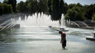 <p>Cooling down at Battersea Park, London. Picture: Jordan Pettitt/PA Wire</p>