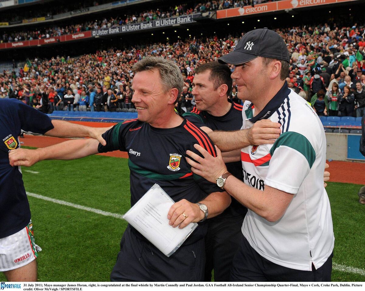 Mayo manager James Horan, right, is congratulated at the final whistle of the 2011 All-Ireland SFC quarter-final by Martin Connelly and Paul Jordan. Pic: Oliver McVeigh / SPORTSFILE