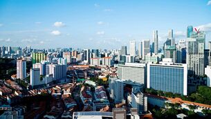 <p>Singapore’s signature public housing is high-rise apartments of up to 50 stories, but many of the structures are softened by green skyways and vertical gardens. File picture</p>