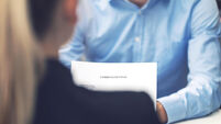 job interview - business woman and candidate at office reading cv