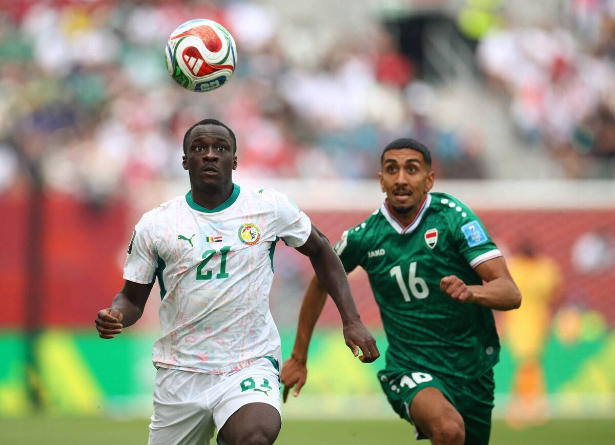 Habib Diarra and Iraq's midfielder Amir Al Ammari fight for the ball. Picture: Cole Burston/Getty