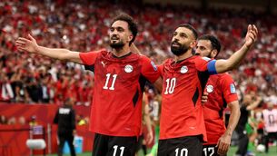 <p>Mohamed Salah and Mostafa Zico celebrate. Picture: Fran Santiago/Getty</p>