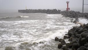 Floods and landslides have been caused by the storms (Kyodo News via AP)