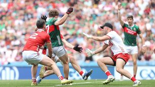 <p>Mayo's Diarmuid Duffy has a shot saved by Patrick Doyle of Cork. Pic: ©INPHO/Bryan Keane</p>
