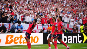 <p>Jude Bellingham, left, brekas out his trademark celebration after scoring against Panama</p>