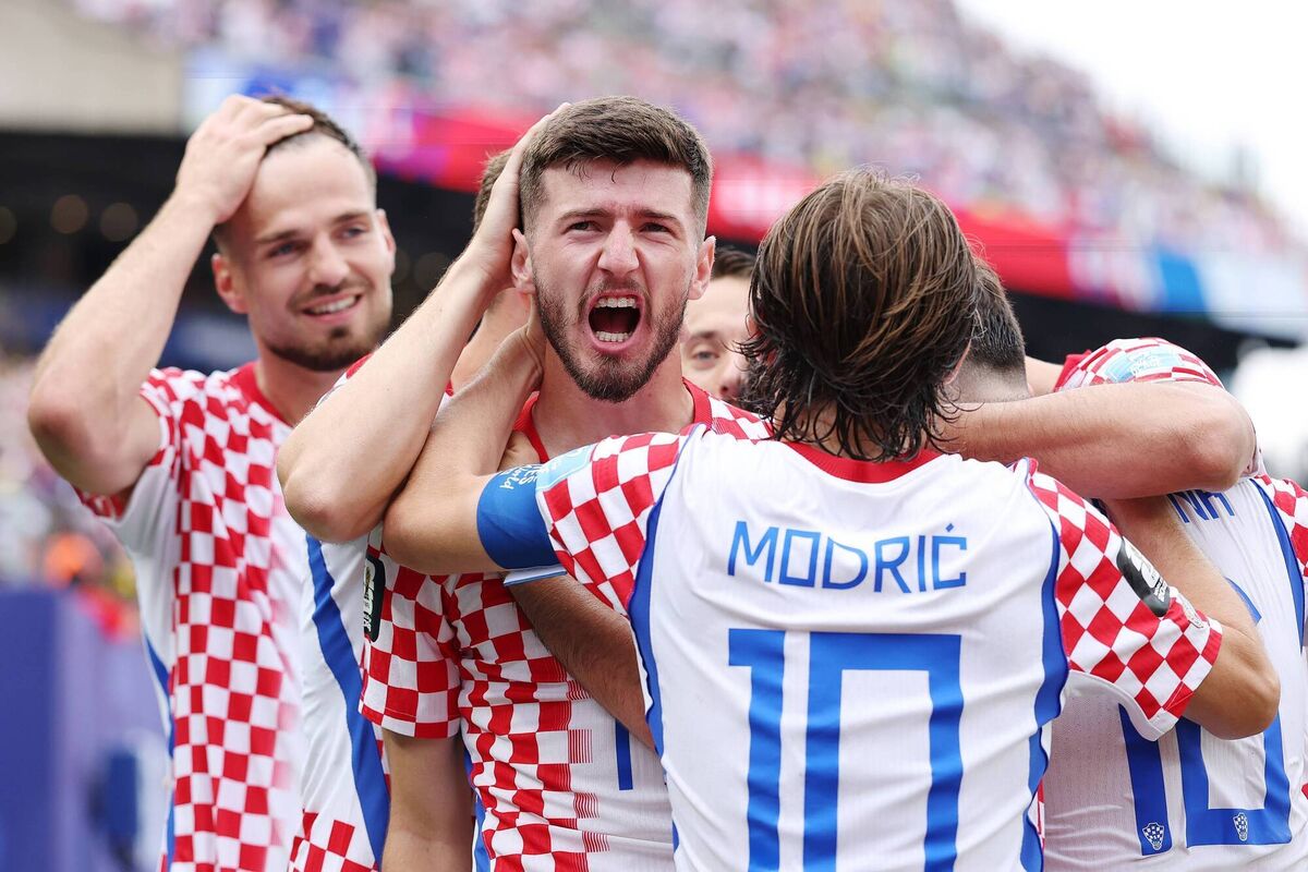Petar Sucic celebrates with teammates. Picture: Dan Mullan/Getty