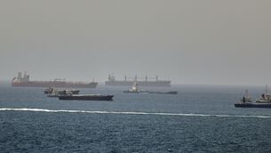 Tankers and cargo vessels are seen in the Gulf of Oman (AP)