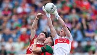 Chris Óg Jones with Enda Hession and goalkeeper Jack Livingstone 27/6/2026