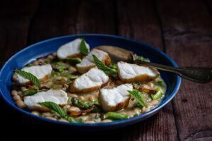 Monkfish with haricot bean, pea and guanciale stew