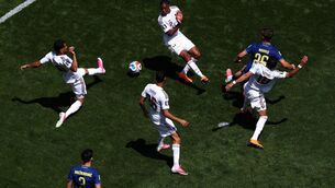 <p>Ermin Mahmic of Bosnia and Herzegovina scores against Qatar despite the efforts of Sultan Al-Brake, Pedro Miguel, Mohamed Manai and Abdulaziz Hatem. (Photo by Dean Mouhtaropoulos/Getty Images)</p>