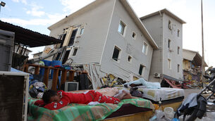 Earthquake-damaged homes in Catia La Mar, Venezuela (Pedro Mattey/AP)