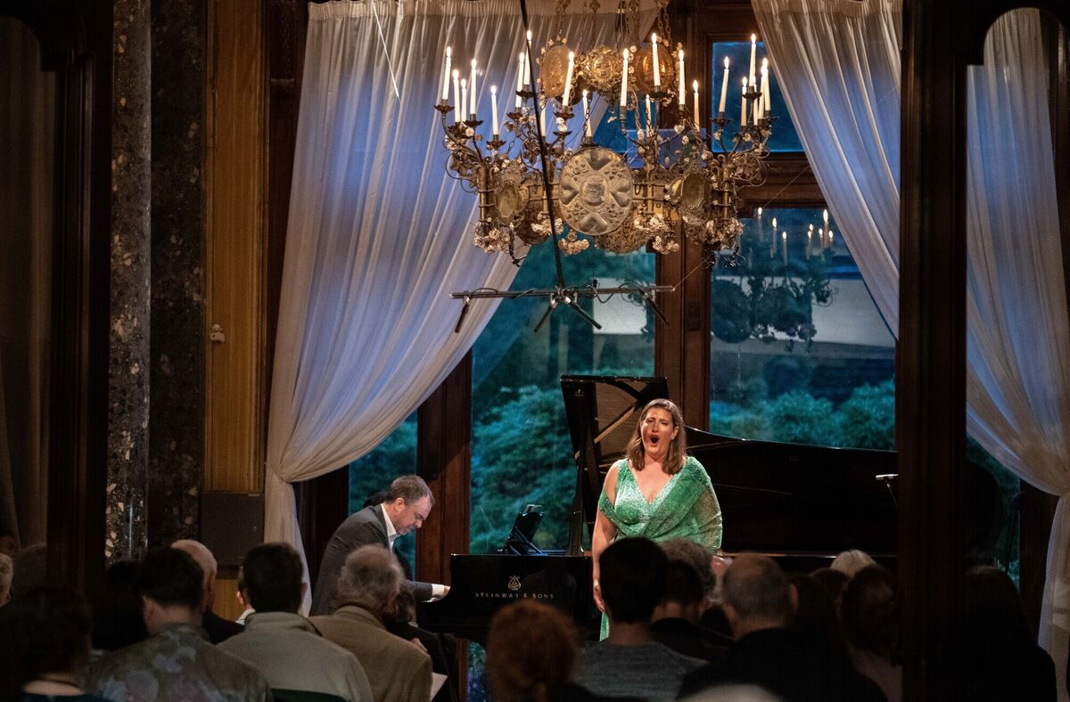  Soprano Katharine Dain with pianist Sam Armstrong performing at the late night candlelit concert. Credit: Karlis Dzjamko