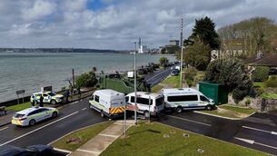 <p>An army heavy-lift recovery truck and garda vans are used to block the main road into Whitegate, Co Cork, in April. The foreign affairs minister is anxious to avoid such scenes during Ireland's presidency of the EU. Picture: Larry Cummins</p>