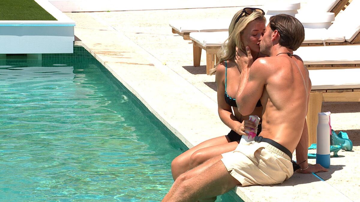 Kav and Charleen locking lips 