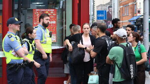<p>Gardaí and firefighters attended the scene of the  fire at Faizan E Madinah on Talbot St in Dublin. Picture: Stephen Collins</p>