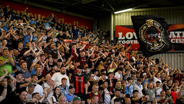 <p>THEN THERE WERE TWO: Bohemians supporters celebrate after their side's win. Pic: Mark Kavanagh/Sportsfile.</p>