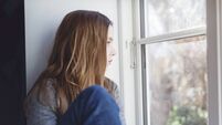 Candid Portrait of a Lonely Twelve Year Old Girl Gazing Out Of a Window
