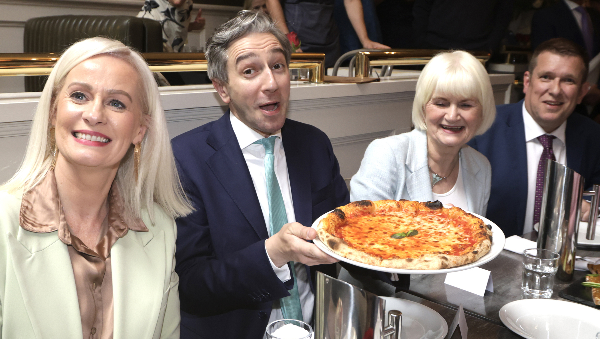 Tánaiste and minister for finance Simon Harris with minister of state at the Department of Further and Higher Education Marian Harkin, minister of state for trade Niamh Smyth, and Restaurants Association of Ireland CEO Adrian Cummins eating food at Pacino's Restaurant, Suffolk St, Dublin aPicture: Leah Farrell/RollingNews.ie