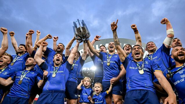 <p>SEEDED: Leinster captain Caelan Doris and departing teammates Luke McGrath and James Lowe lifts the trophy after the United Rugby Championship grand final. Pic: Brendan Moran/Sportsfile.</p>