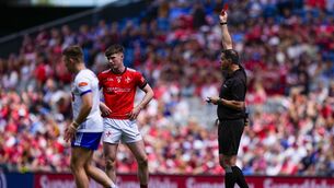 <p>Seán Hurson gives a red card to Sean Callaghan of Louth. Pic: James Lawlor/Inpho</p>
