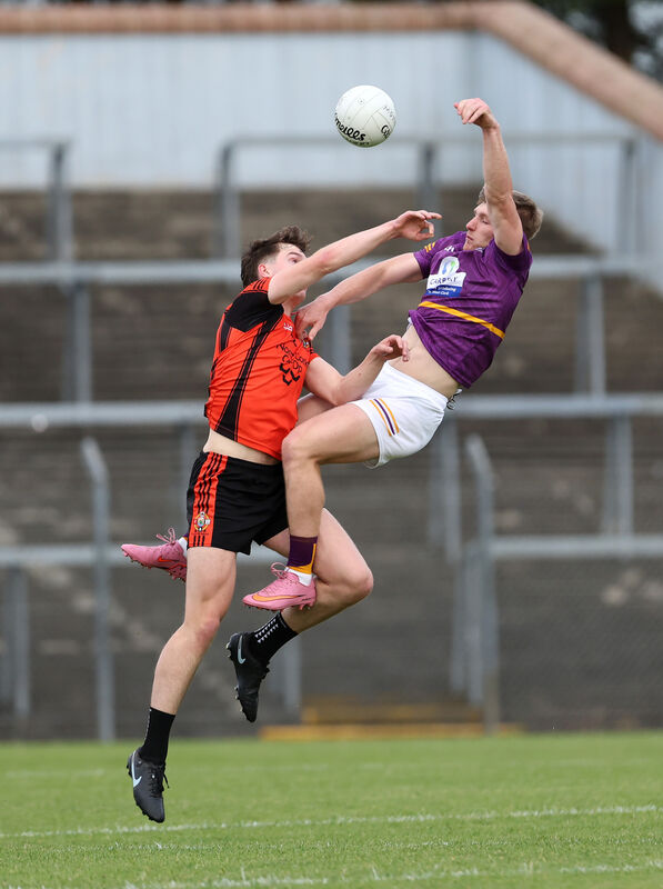  Ewan Murphy, Duhallow, battles for aerial possession with Matthew Sheehan, Carbery. Pic: Jim Coughlan.