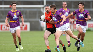 <p> Seamus Hickey, Duhallow, jostles with Olan Corcoran, Aaron Hayes and Killian O'Brien of Carbery. Pic: Jim Coughlan.</p>