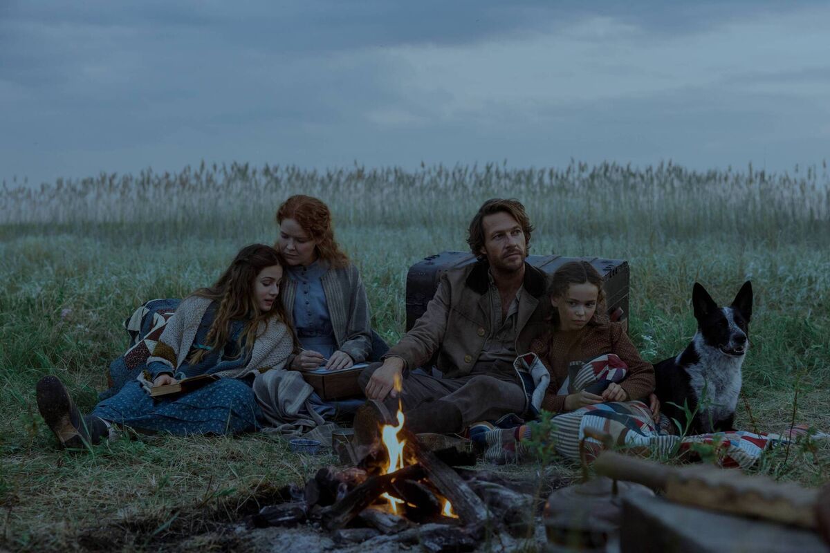 (Left to right) Skywalker Hughes as Mary Ingalls, Crosby Fitzgerald as Caroline Ingalls, Luke Bracey as Charles Ingalls, and Alice Halsey as Laura Ingalls in episode 101 of Little House on the Prairie. Photo: Eric Zachanowich/Netflix © 2026 (Left to right) Skywalker Hughes as Mary Ingalls, Crosby Fitzgerald as Caroline Ingalls, Luke Bracey as Charles Ingalls, and Alice Halsey as Laura Ingalls in episode 101 of Little House on the Prairie. Photo: Eric Zachanowich/Netflix © 2026