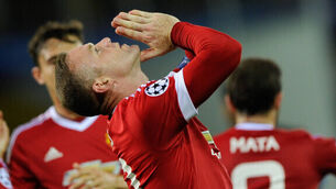 Rooney ends goal-drought with hat-trick as United progress to Champions League