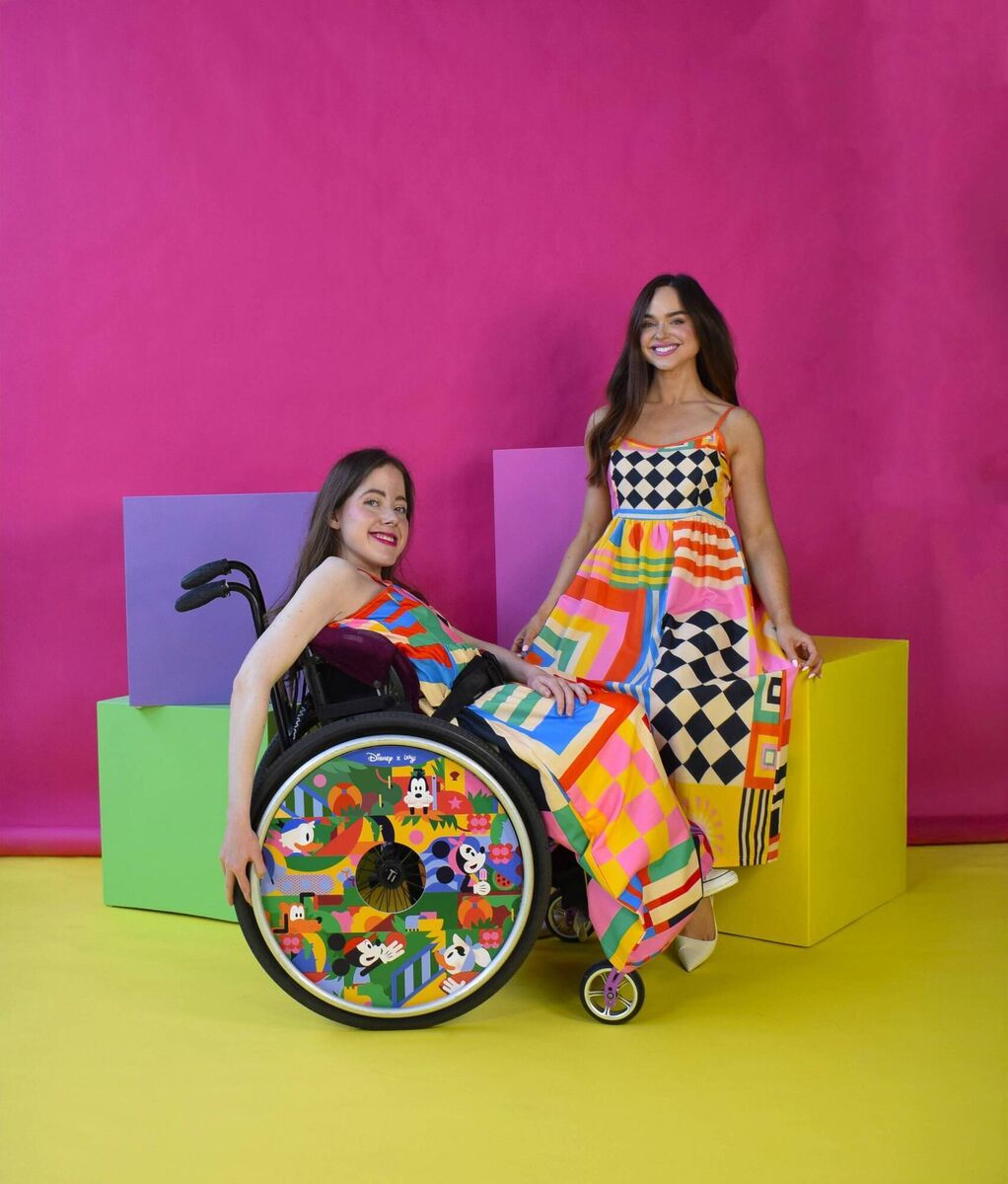 Ailbhe Keane (right), with her sister Izzy showcasing their new Disney themed wheelchair covers