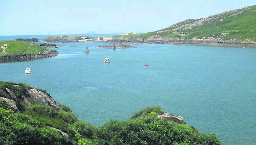 Derrynane Bay, with the Skellig Islands away in the distance. Derrynane Bay, with the Skellig Islands away in the distance.