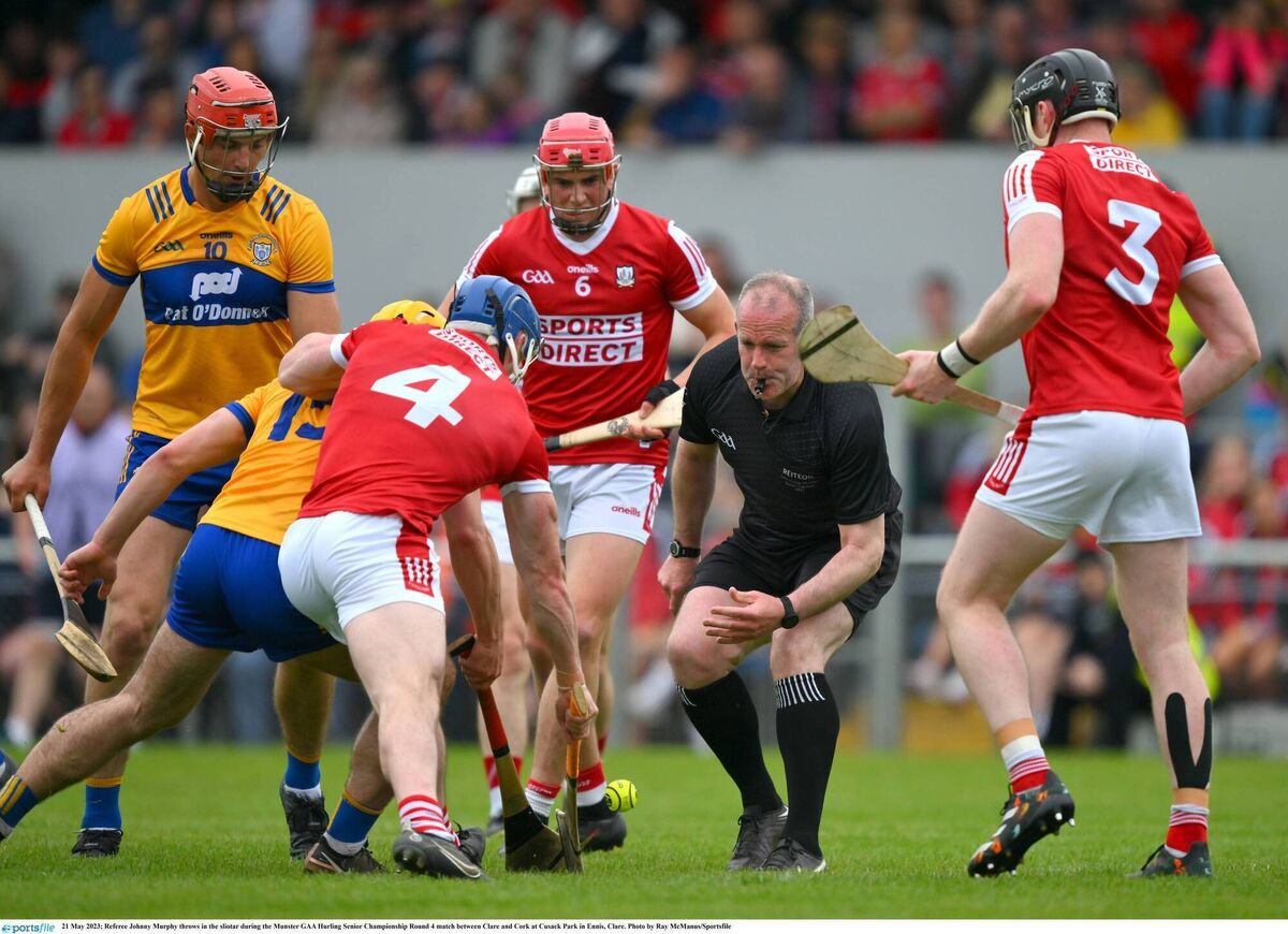 Referee Johnny Murphy throws in the sliotar between Clare and Cork at Cusack Park. Picture: Ray McManus/Sportsfile Referee Johnny Murphy throws in the sliotar between Clare and Cork at Cusack Park. Picture: Ray McManus/Sportsfile