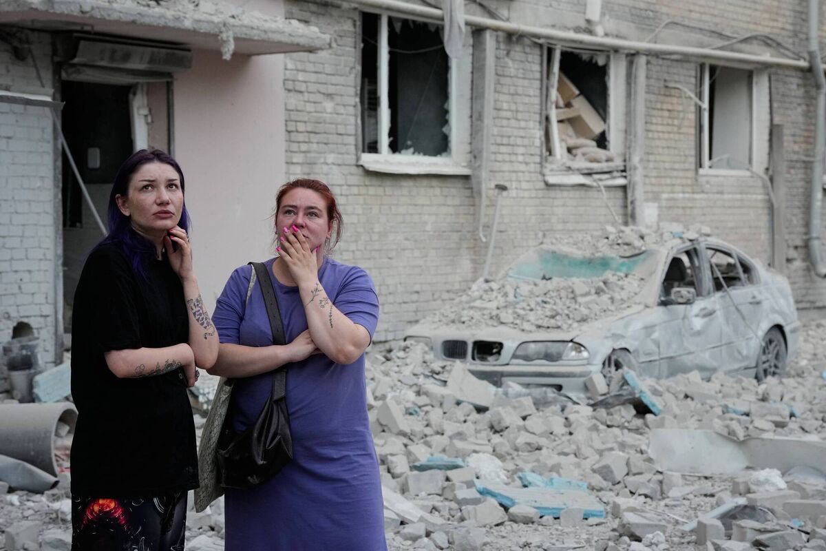 People react at the site of a Russian missile strike that hit a residential building in Kyiv, Ukraine, Thursday, July 2, 2026. (AP Photo/Efrem Lukatsky)