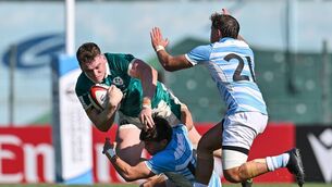 <p>Ireland's Jack Deegan is tackled by Argentina's Federico Serpa Laporte. Pic: ©INPHO/Levan Verdzeuli</p>