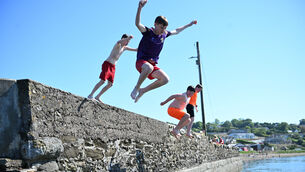 <p> Making a splash: Ronan Lorcan, Alex Connolly, Jacob Cruise and Kaiden Deady-O'Flynn making the most of the sunny weather and high temperatures as they cool off at Aghada Pier, Co Cork. Picture: Larry Cummins</p>