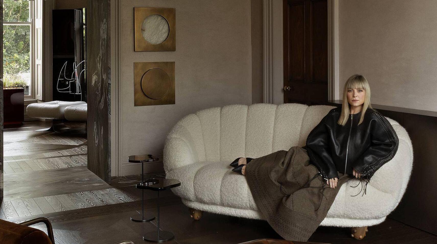 Róisín Lafferty sits on a white bouclé Bryan O’Sullivan croissant sofa in her gallery at her studio at 23 Fitzwilliam Square South, Dublin. Pictures: Barbara Corsico
