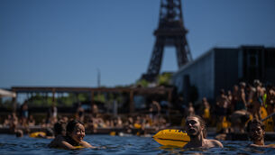People swim in the Seine (Aurelien Morissard/AP)