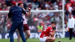 <p>CONTRAST: While Galway celebrate, Cork's Barry Walsh sits dejected after another Croke Park second half collapse. Pic: James Crombie, Inpho</p>