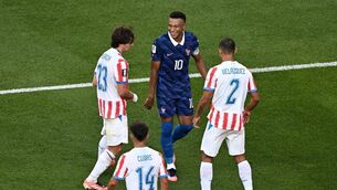 <p>LAUGH IT OFF: French talisman Kylian Mbappe smiles at Paraguay trio Matias Galarza, Gustavo Velazquez and midfielder Andres Cubas in Saturday night's World Cup round of 16 clash in Philadelphia. Pic: Jewel Samad/AFP via Getty Images</p>