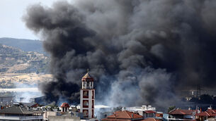 Thick smoke rises above the village of Filothei during a wildfire on the outskirts of the northern city of Thessaloniki, Greece (Giannis Papanikos/AP) Thick smoke rises above the village of Filothei during a wildfire on the outskirts of the northern city of Thessaloniki, Greece (Giannis Papanikos/AP)