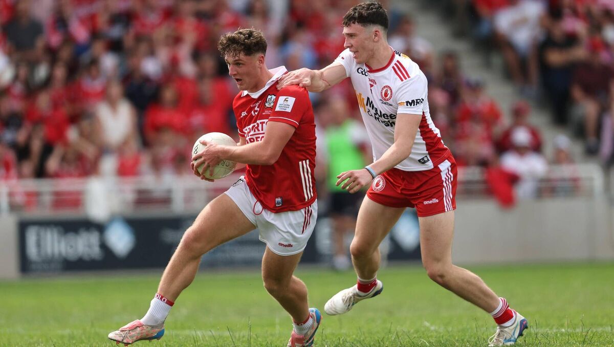 Cork's Tom Whooley powers past the Tyrone challenge of Matthew J Daly. Pic: Bryan Keane, Inpho Cork's Tom Whooley powers past the Tyrone challenge of Matthew J Daly. Pic: Bryan Keane, Inpho