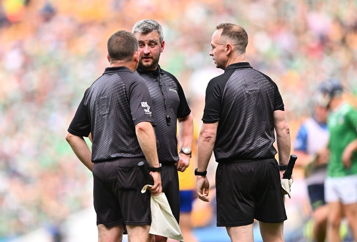Referee Thomas Walsh, centre, speaking with his line umpires Colm Lyons, left, and Chris Mooney before showing the yellow card to Limerick goalkeeper Nickie Quaid. Pic: Piaras Ó Mídheach/Sportsfile. Referee Thomas Walsh, centre, speaking with his line umpires Colm Lyons, left, and Chris Mooney before showing the yellow card to Limerick goalkeeper Nickie Quaid. Pic: Piaras Ó Mídheach/Sportsfile.