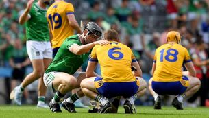 <p>BATTLE: Diarmaid Byrnes of Limerick consoles David McInerney of Clare after the GAA Hurling All-Ireland Senior Championship semi-final match between Clare and Limerick at Croke Park in Dublin. Photo by John Sheridan/Sportsfile</p>