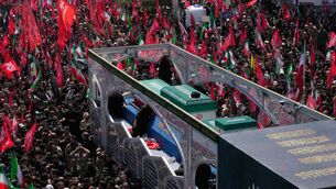 The coffins of Ayatollah Ali Khamenei and members of his family makes its way through mourners (AP) The coffins of Ayatollah Ali Khamenei and members of his family makes its way through mourners (AP)