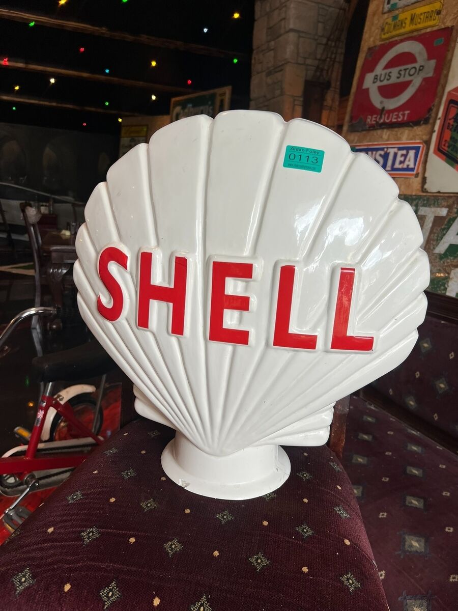 A Shell fibreglass petrol pump globe at Aidan Foley's sale. A Shell fibreglass petrol pump globe at Aidan Foley's sale.