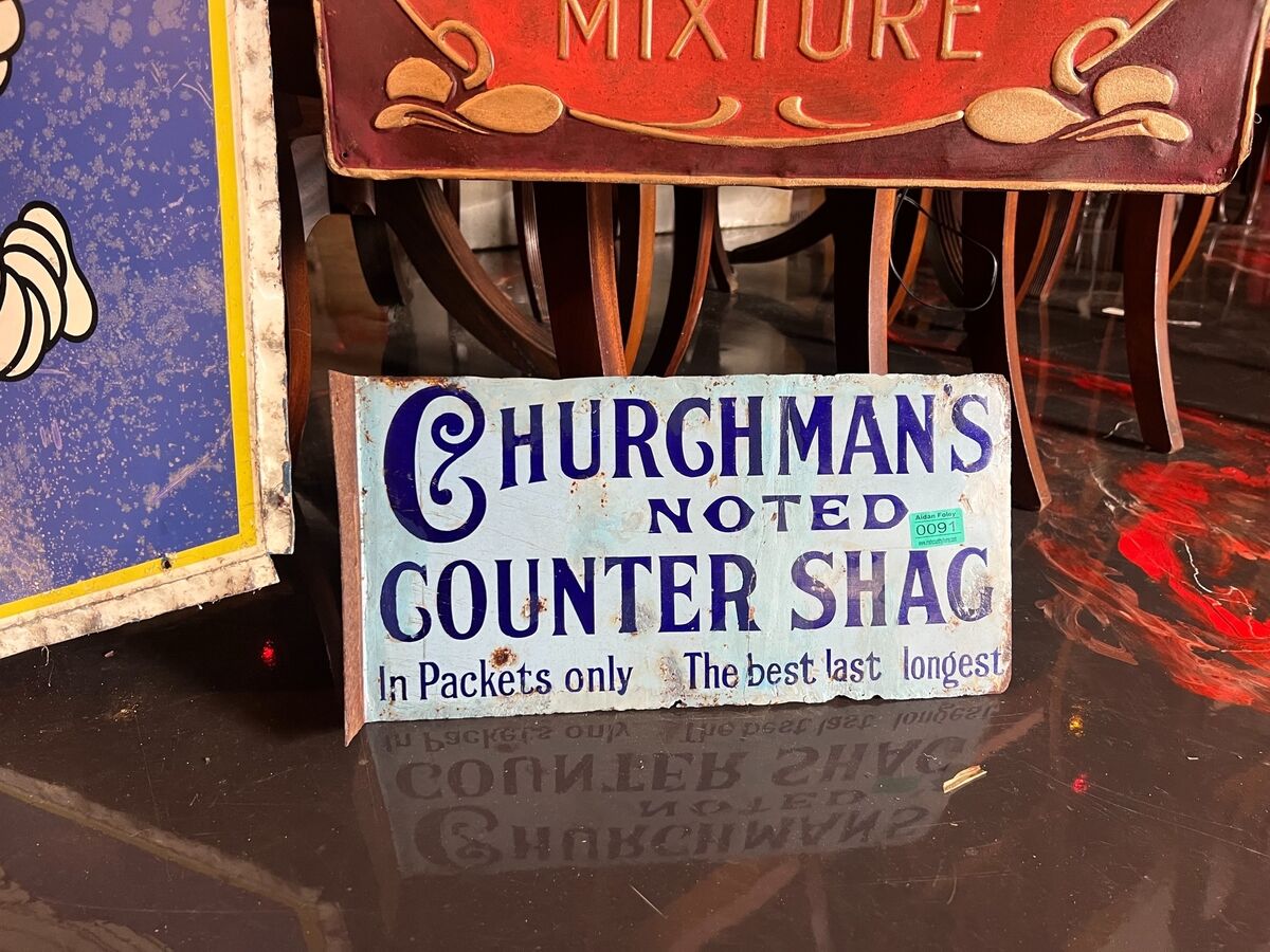 An enamel double-sided tobacco sign at Aidan Foley's sale. An enamel double-sided tobacco sign at Aidan Foley's sale.