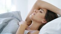 Depression, relax and woman in bed in home with loneliness, sadness or mental health. Anxiety, insomnia and female person restin