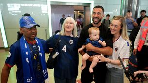 <p>Cape Verde footballer Pico Lopes is greeted by his parents Carlos and Judie Lopes. his wife Leah and eight-month-old son Diego as he returns home to Dublin Airport. Pic: Niall Carson/PA Wire</p>