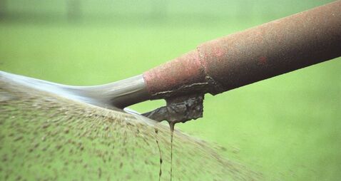 Agricultural slurry spreading in a field in England, United Kingdom