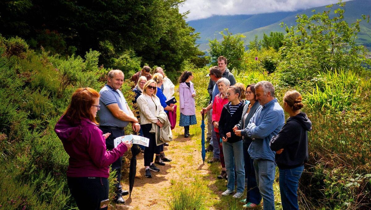 Grainne Fitzgerald introducing and leading the wellbeing walk overlooking the Galtee Mountains. Grainne Fitzgerald introducing and leading the wellbeing walk overlooking the Galtee Mountains.